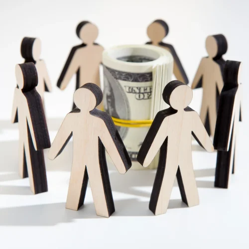 close-up-of-investors-around-savings-deciding-wher-2025-03-18-17-47-14-utc